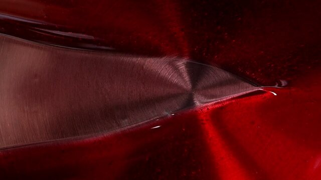 Red syrup fills the stewpan. Dessert making process. High quality FullHD footage