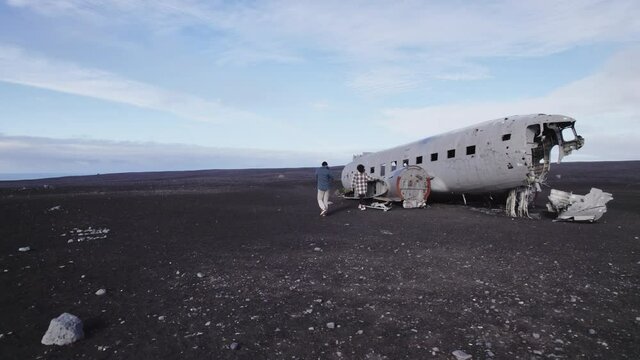 Travelers Walking Outside the Solheimasandur Plane Wreck