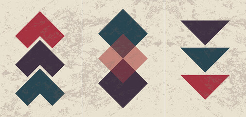 dark set of geometric abstract posters on the wall. Triangle, square, texture.