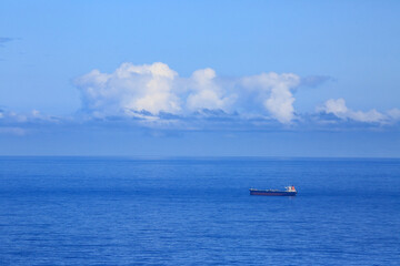 Aerial view of large tanker and cargo cruising in the middle of the indian ocean