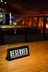 A modern idea for a reserved table with the inscription Reservation of your place. Idea restaurants...