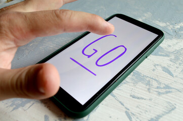 man presses the start button