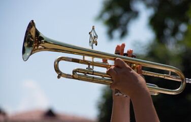 Fototapeta na wymiar playing a brass instrument. military band performs at the festival