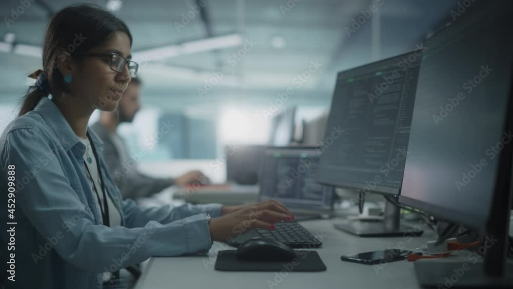 Poster Real Diverse Office: Indian IT Programmer Working on Desktop Computer. Female Specialist Creating Innovative Software. Engineer Developing App, Program, Video Game. Writing Code in Terminal. Arc Shot
