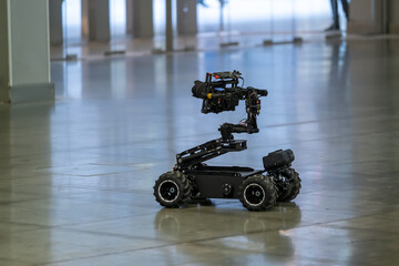Unmanned vehicle with camera driving on floor