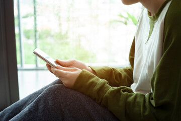 Closeup woman hand touch screen on smart phone, marketing technology and business concept.