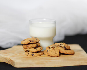 Chocolate biscuits with chocolate chip topping as snacks in the morning, are very popular among children to old age. Biscuits and milk are the perfect combination of food and drink. Biscuit mockup.
