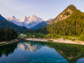 Fototapeta na wymiar Alpine lake Jasna in Slovenia. Drone View at Sunrise