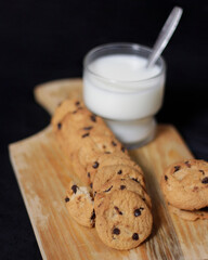 Chocolate biscuits with chocolate chip topping as snacks in the morning, are very popular among children to old age. Biscuits and milk are the perfect combination of food and drink. Biscuit mockup.