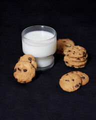Chocolate biscuits with chocolate chip topping as snacks in the morning, are very popular among children to old age. Biscuits and milk are the perfect combination of food and drink. Biscuit mockup.