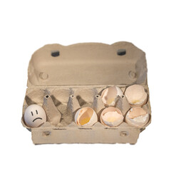 Eggs packaging carton box with 5 broken chicken eggs and one not, with drawn unhappy face on it,...