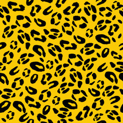 Leopard print seamless pattern. Vector illustration on yellow background