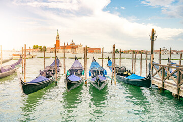 Moored gondolas at St. Mark Square with Church of San Giorgio Maggiore on background. Venice, Italy