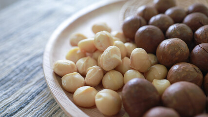 Organic Macadamia nut. macadamia nuts are cracked and baked to taste extremely delicious superfood fresh natural shelled unsalted raw macadamia and healthy food concept