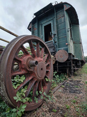 Fototapeta na wymiar Old historic train depot rusty wheel and wagon