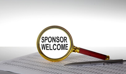 Inscription SPONSOR WELCOME on the magnifying glass with chart and pen