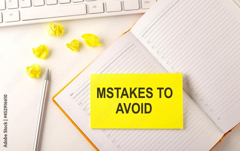 Poster mistakes to avoid text on sticker on the diary with keyboard and pencil