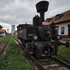 Fototapeta na wymiar Old historic train depot black locomotive