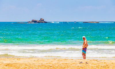 Fototapeta na wymiar Russian tourist at beautiful sunny Bentota Beach on Sri Lanka.