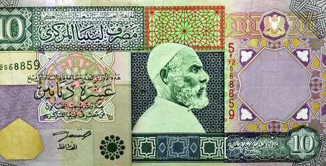 Large fragment of the obverse side of 10 ten Libyan dinars banknote currency issued 2002 by the...
