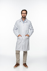Doctor in eyeglasses and coat looking at camera on white background