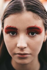 beautiful young girl model with bright red makeup.