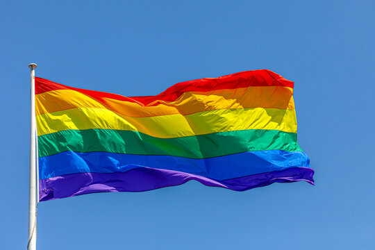 rainbow flag on blue sky