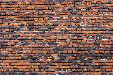 Old wall made of red bricks for the background