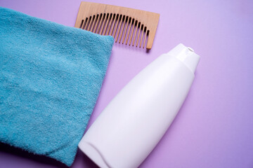 bottle of shampoo or hair conditioner, on a pink background