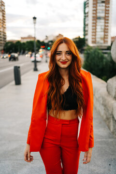 Content Stylish Redhead Woman In Suit In City