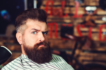 Bearded man at barber shop. Men hairstyle, beard and mustache. Fashion and male beauty.