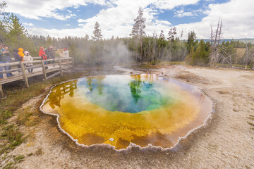 YELLOWSTONE PARK, USA - AUGUST 28: Tourist visiting morning Glory Thermal Pool in Yellowstone...