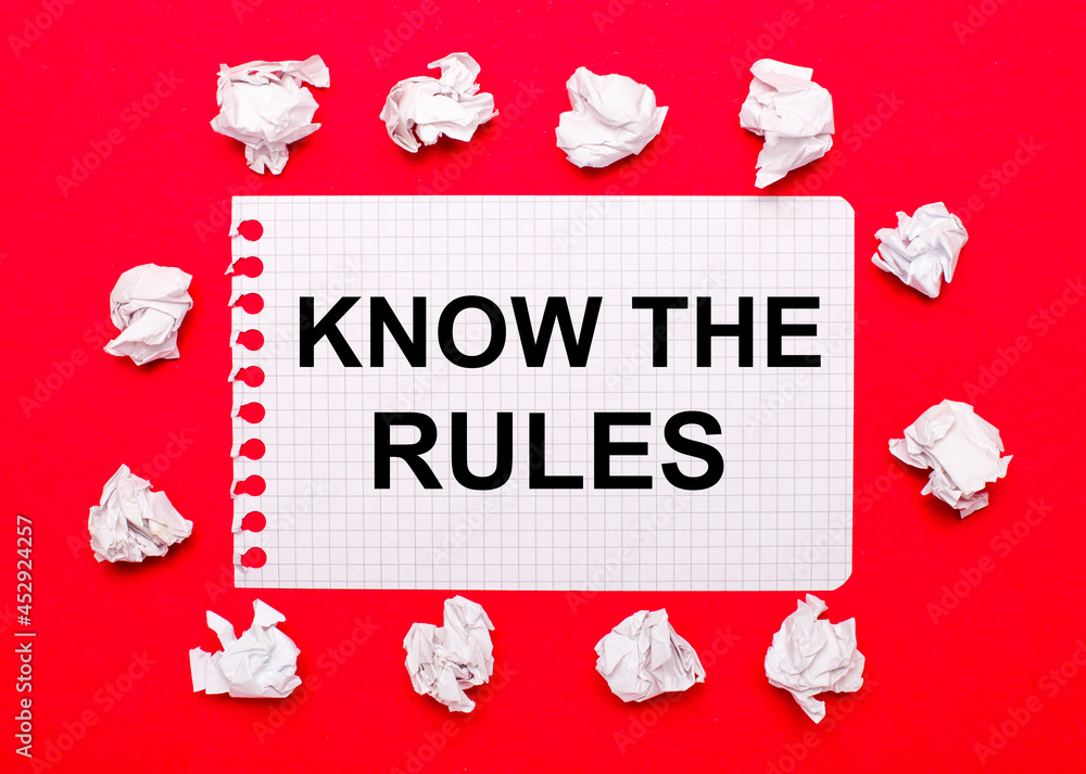 Poster on a bright red background, white crumpled sheets of paper and a sheet of paper with the text know t