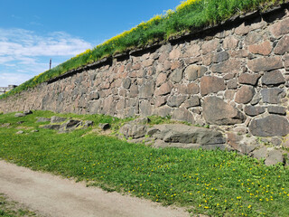 The wall of the Panzerlaks Bastion, built in the 16th century, in the city of Vyborg on a clear...