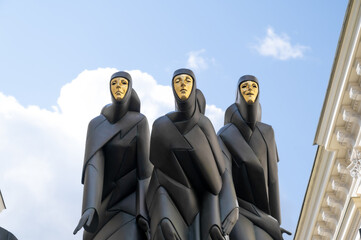 three statues with the golden mask in vilnius - 452927200