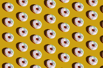 a pattern of white and black doughnuts. food pattern background texture splash screen.