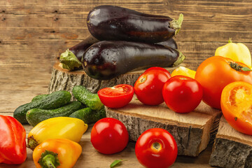 Assortment of fresh vegetables on a wooden background