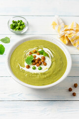 Split pea soup roasted chickpeas on wooden background. Copy space.