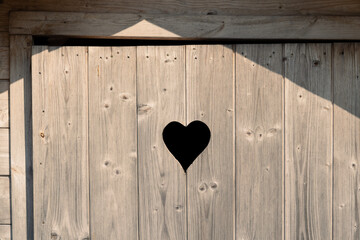 Country toilet door with heart