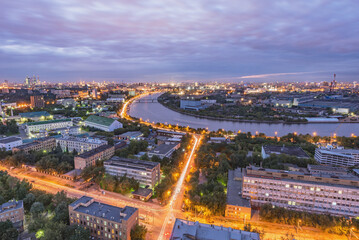 Fototapeta na wymiar Aerial city view by the river at sunset. Moscow.