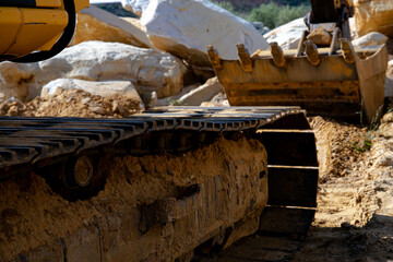 Dump truck transports sand in open pit mine. Excavator on the development of sand in a quarry. Mining industry concept