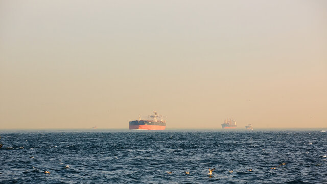 Large cargo container ship passing through Bosphorus, Istanbul, Turkey.