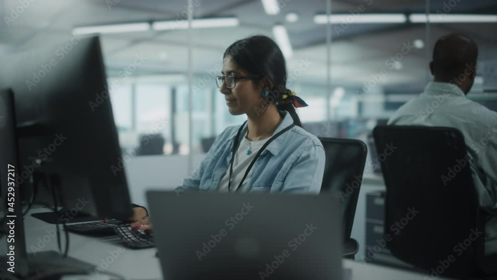 Fototapete Diverse Office: Portrait of Talented Indian Girl IT Programmer Working on Desktop Computer in Friendly Multi-Ethnic Environment. Female Software Engineer Wearing Glasses Develop Inspirational App