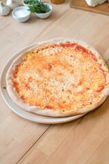 Traditional Italian pizza margherita with tomatoes, mozzarella cheese. Selective focus