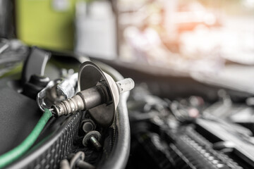 Fototapeta premium Close up oxygen sensor of gasoline engine has a condition that is old and dusty Maintenance period the exhaust system