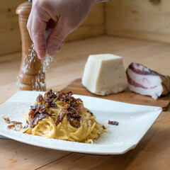 Bucatini alla gricia, traditional Italian pasta based on guanciale (cured pork cheek), pecorino cheese, and black pepper