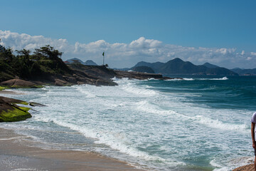 Fototapeta na wymiar Walking through the beautiful beach of Ipanema