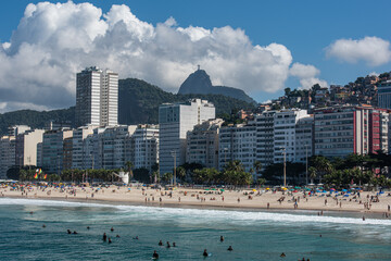 Walking through the beautiful beach of Copacabana