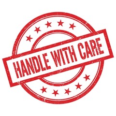 HANDLE WITH CARE text written on red vintage round stamp.