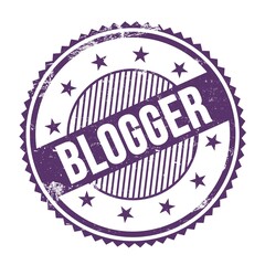 BLOGGER word written on violet round stamp